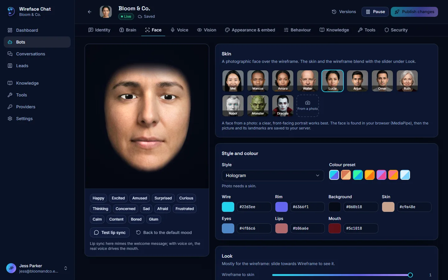 The Face tab: a large live face on the left with mood buttons, and a gallery of faces, styles and colours on the right.